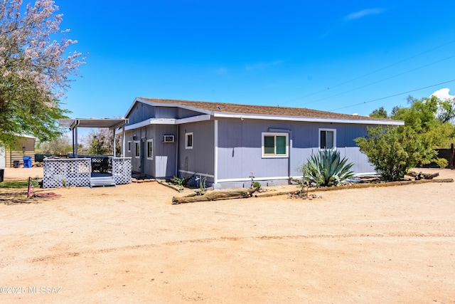 view of front of property with a wooden deck