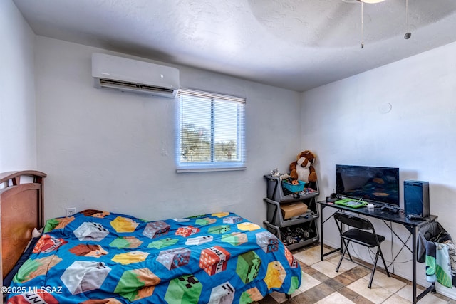bedroom with a wall mounted AC and ceiling fan