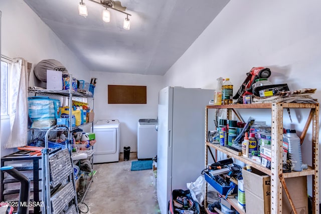 storage room featuring washer and dryer