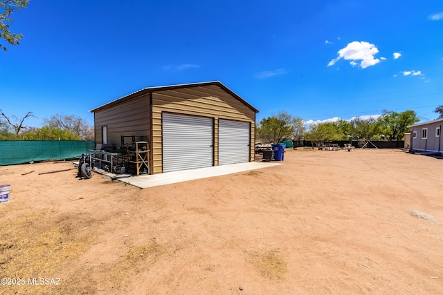 detached garage with fence