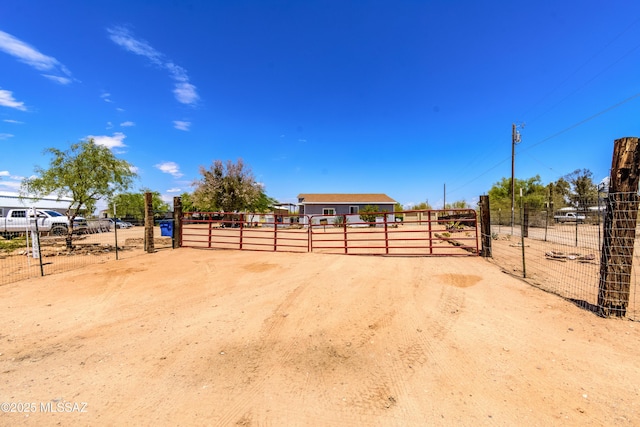 view of property's community featuring a gate and fence