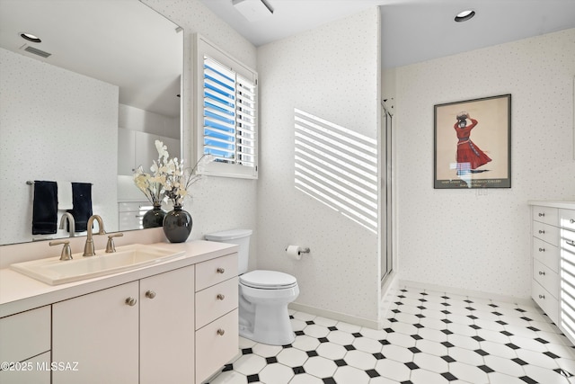 6461 N Thimble Pass, Tucson, AZ 85750 - bathroom featuring wallpapered walls, tile patterned floors, a shower stall, vanity, and toilet