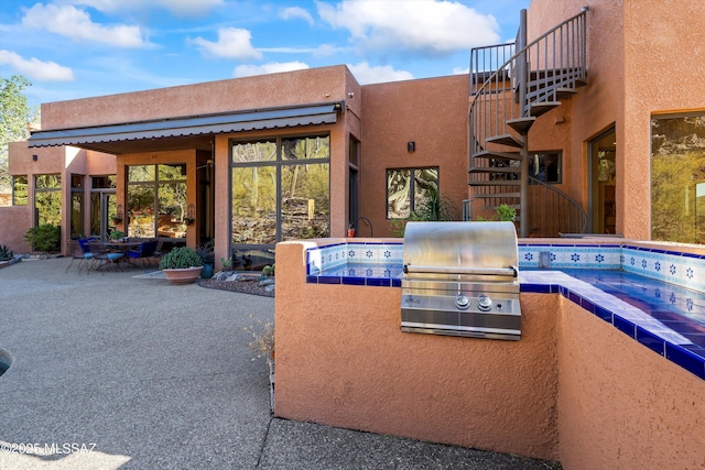 6461 N Thimble Pass, Tucson, AZ 85750 - view of patio / terrace featuring grilling area, stairs, area for grilling, and a jacuzzi