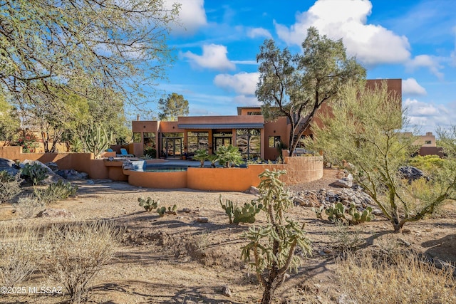 6461 N Thimble Pass, Tucson, AZ 85750 - back of house with stucco siding, a pool, and fence