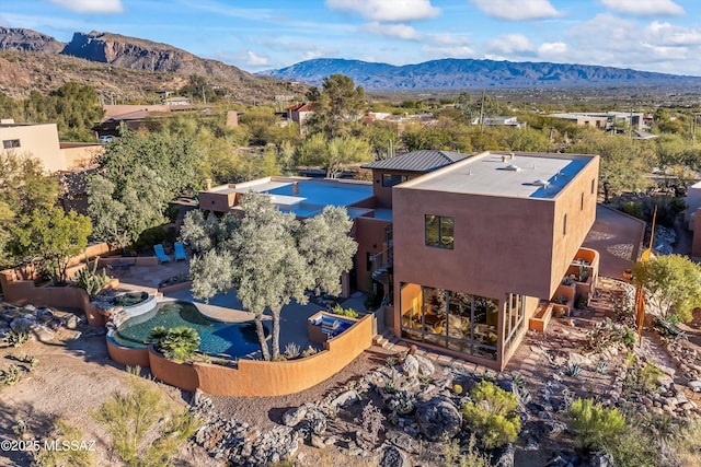 6461 N Thimble Pass, Tucson, AZ 85750 - aerial view of property and surrounding area featuring a mountainous background and a pool area