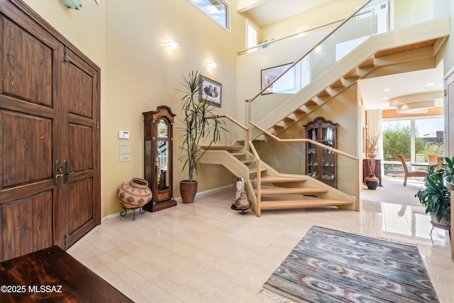 6461 N Thimble Pass, Tucson, AZ 85750 - foyer featuring stairs, a high ceiling, and baseboards