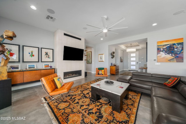 10465 E Ocotillo Rim Trl, Vail, AZ 85641 - living area with ceiling fan, recessed lighting, a tiled fireplace, and baseboards