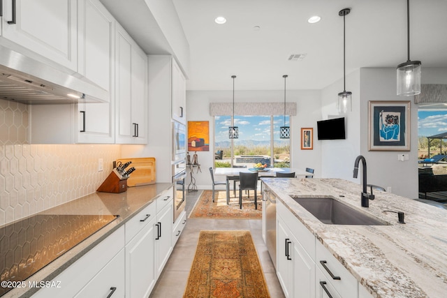 10465 E Ocotillo Rim Trl, Vail, AZ 85641 - kitchen featuring a sink, oven, backsplash, white cabinets, and recessed lighting