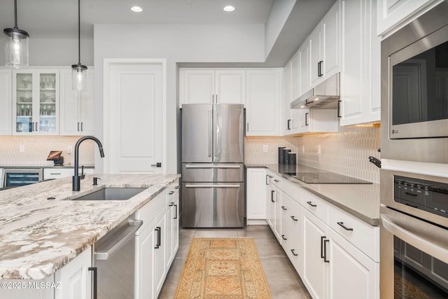 10465 E Ocotillo Rim Trl, Vail, AZ 85641 - kitchen featuring appliances with stainless steel finishes, a sink, under cabinet range hood, decorative backsplash, and recessed lighting