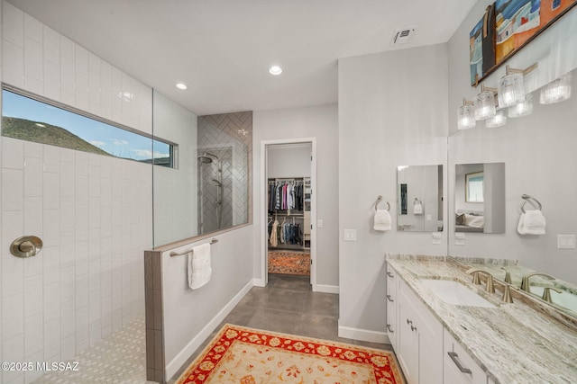 10465 E Ocotillo Rim Trl, Vail, AZ 85641 - bathroom featuring a walk in shower, vanity, recessed lighting, baseboards, and plenty of natural light