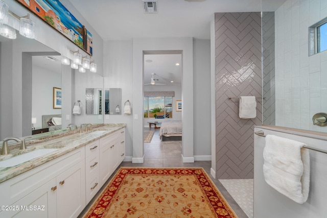 10465 E Ocotillo Rim Trl, Vail, AZ 85641 - ensuite bathroom featuring walk in shower, double vanity, tile patterned floors, and plenty of natural light