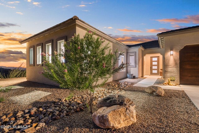 10465 E Ocotillo Rim Trl, Vail, AZ 85641 - view of front of property with stucco siding and an attached garage