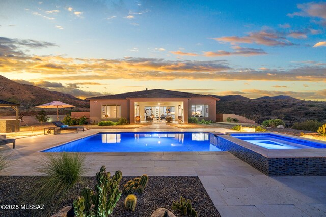 10465 E Ocotillo Rim Trl, Vail, AZ 85641 - swimming pool with an in-ground hot tub, a patio, and a mountain view