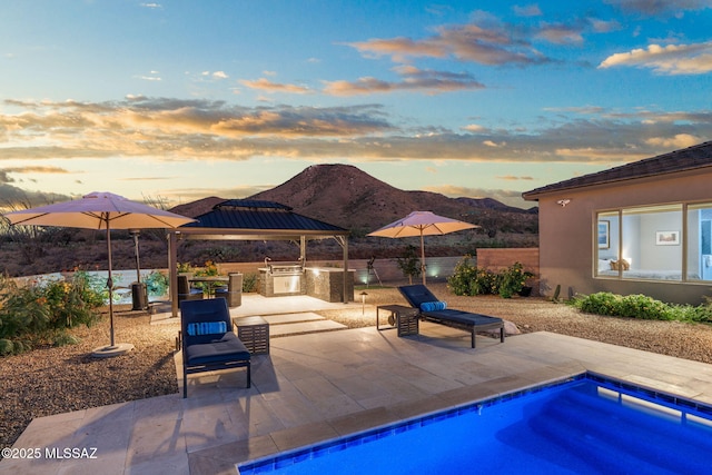 10465 E Ocotillo Rim Trl, Vail, AZ 85641 - view of pool featuring a gazebo, area for grilling, a mountain view, and a patio area