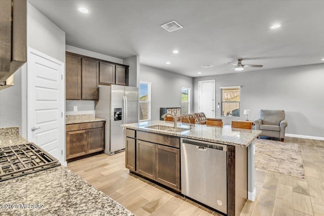 10094 N Cardon Grande Trl, Marana, AZ 85653 - kitchen featuring refrigerator with ice dispenser, stainless steel dishwasher, a sink, a ceiling fan, and open floor plan