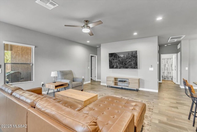 10094 N Cardon Grande Trl, Marana, AZ 85653 - living area featuring light wood finished floors, a ceiling fan, baseboards, and recessed lighting