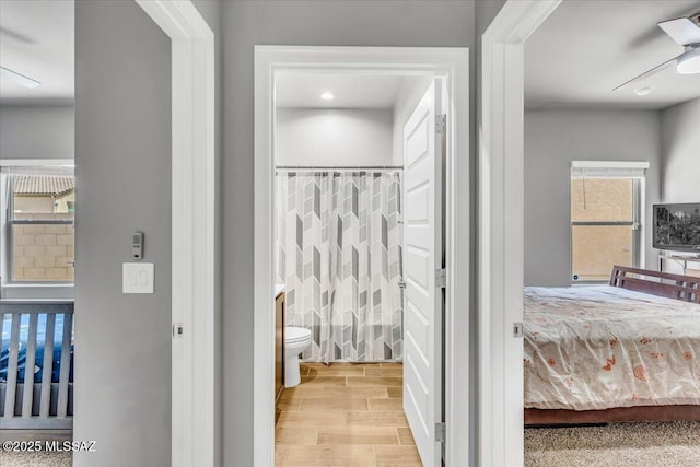 10094 N Cardon Grande Trl, Marana, AZ 85653 - full bathroom with toilet, a shower with curtain, and wood finished floors