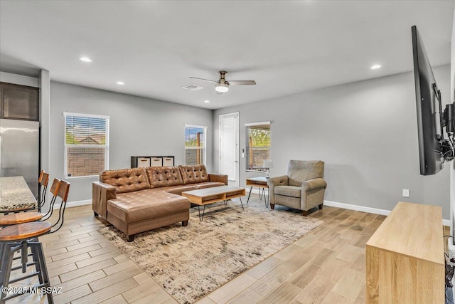 10094 N Cardon Grande Trl, Marana, AZ 85653 - living room featuring light wood-style floors, a ceiling fan, recessed lighting, and baseboards