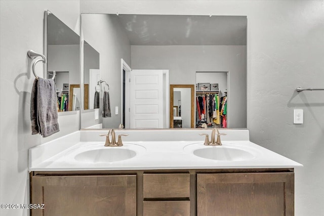 10094 N Cardon Grande Trl, Marana, AZ 85653 - bathroom with double vanity and a spacious closet