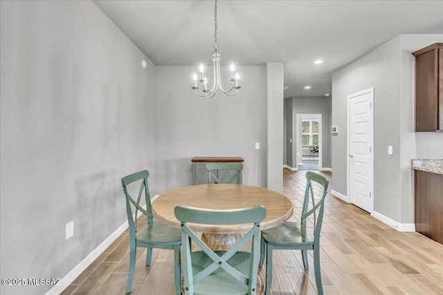 10094 N Cardon Grande Trl, Marana, AZ 85653 - dining space featuring light wood-style floors, a chandelier, baseboards, and recessed lighting