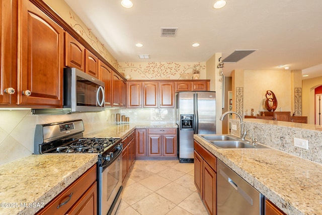 2337 S Via Vespucci, Green Valley, AZ 85614 - kitchen featuring appliances with stainless steel finishes, a sink, light countertops, backsplash, and recessed lighting