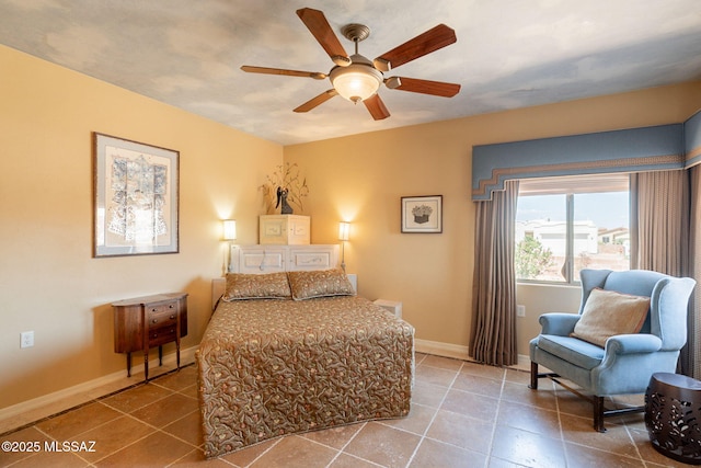2337 S Via Vespucci, Green Valley, AZ 85614 - tiled bedroom featuring baseboards and a ceiling fan