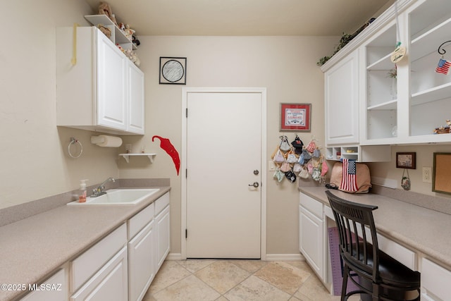 2337 S Via Vespucci, Green Valley, AZ 85614 - laundry room featuring a sink, a desk, and baseboards