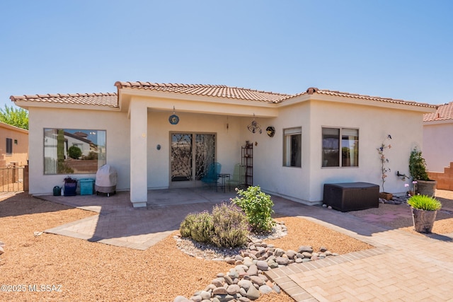 2337 S Via Vespucci, Green Valley, AZ 85614 - view of front of house with a patio, stucco siding, and a tiled roof