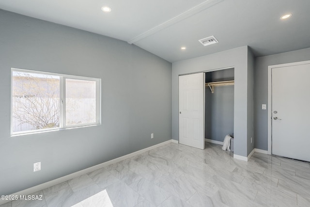 unfurnished bedroom featuring marble finish floors, baseboards, a closet, recessed lighting, and lofted ceiling