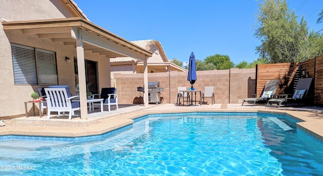2866 W Medallion Dr, Tucson, AZ 85741 - view of pool featuring a patio, fence, and grilling area