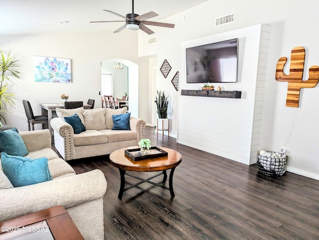 2866 W Medallion Dr, Tucson, AZ 85741 - living room featuring arched walkways, a ceiling fan, dark wood-style floors, lofted ceiling, and baseboards