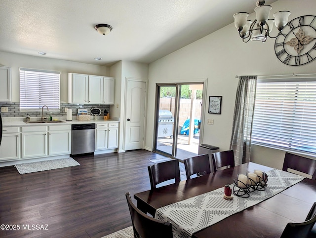 2866 W Medallion Dr, Tucson, AZ 85741 - dining space featuring a chandelier, dark wood-type flooring, and vaulted ceiling