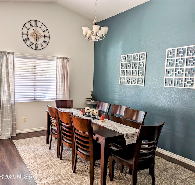 2866 W Medallion Dr, Tucson, AZ 85741 - dining room featuring a chandelier, wood finished floors, baseboards, and vaulted ceiling