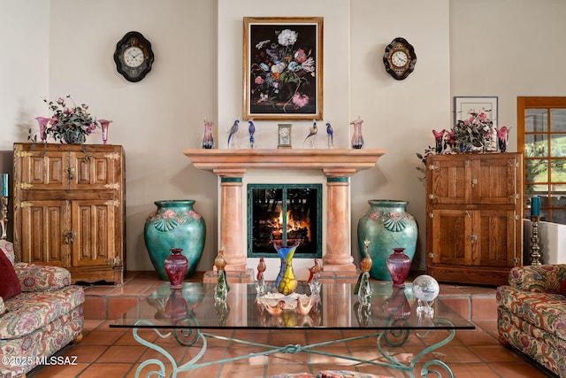 living area with tile patterned floors