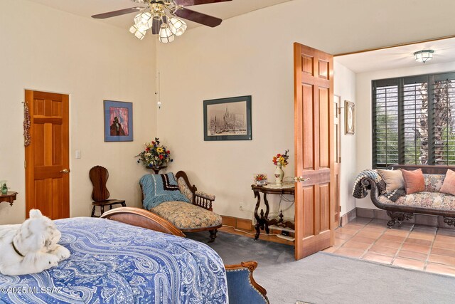 bedroom featuring carpet, baseboards, and ceiling fan