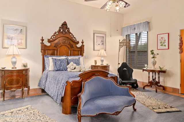 bedroom featuring carpet, a ceiling fan, and baseboards