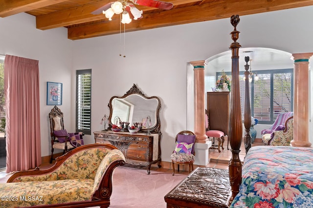 bedroom with decorative columns, arched walkways, beam ceiling, and wood ceiling