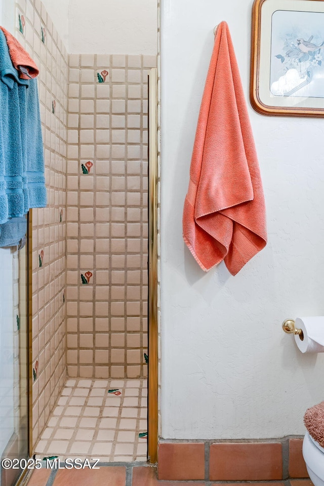 bathroom with a shower stall