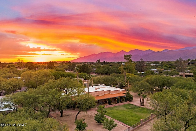 aerial view of property and surrounding area featuring mountains