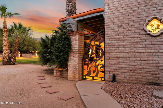 view of exterior entry at dusk