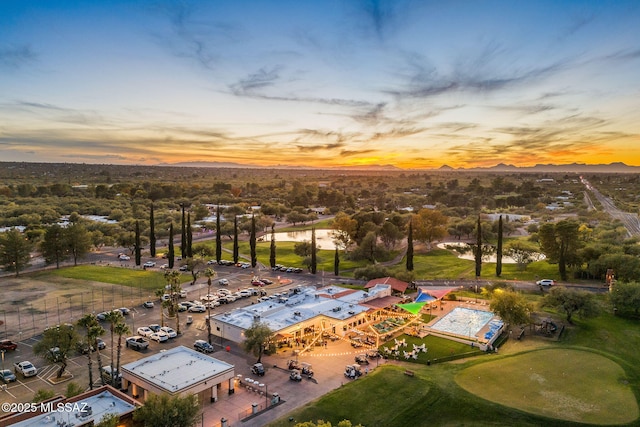 aerial view at dusk of view of golf course