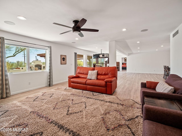 5825 N Camino Miraval Dr, Tucson, AZ 85718 - living room featuring light wood-style floors, a ceiling fan, recessed lighting, and baseboards