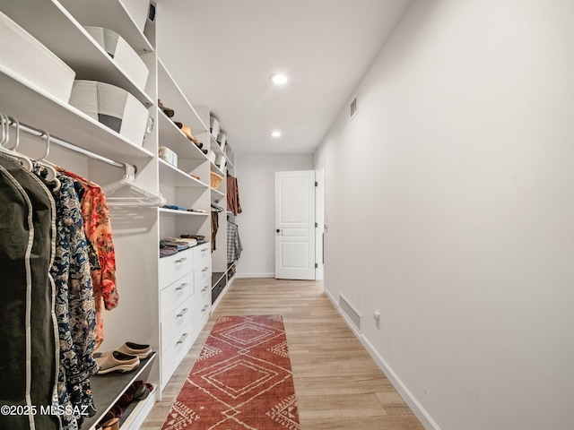 5825 N Camino Miraval Dr, Tucson, AZ 85718 - walk in closet with light wood-style floors