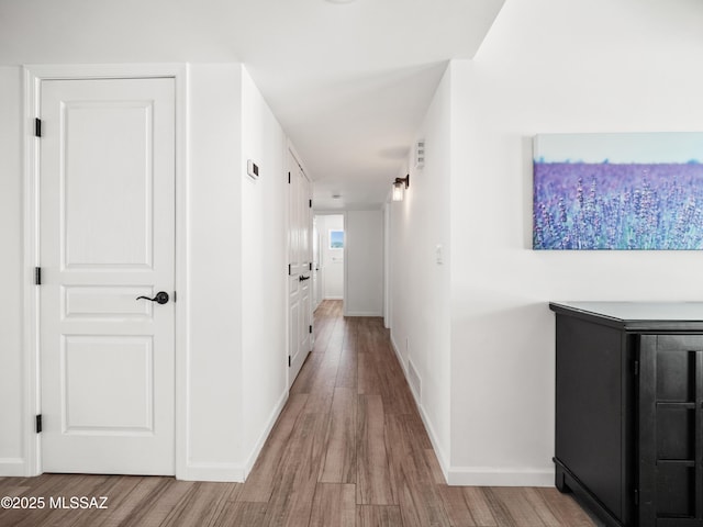 5825 N Camino Miraval Dr, Tucson, AZ 85718 - corridor featuring wood finished floors and baseboards