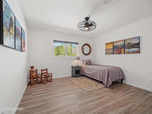 5825 N Camino Miraval Dr, Tucson, AZ 85718 - bedroom featuring light wood-style flooring and baseboards
