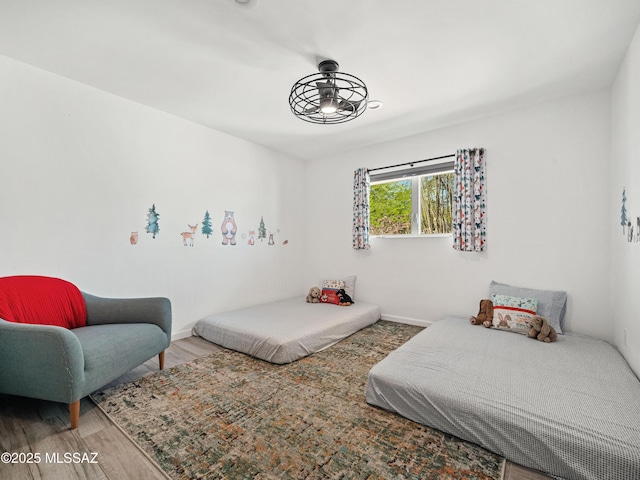 5825 N Camino Miraval Dr, Tucson, AZ 85718 - bedroom featuring wood finished floors and baseboards