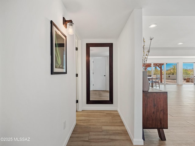 5825 N Camino Miraval Dr, Tucson, AZ 85718 - corridor with baseboards, wood finished floors, and recessed lighting