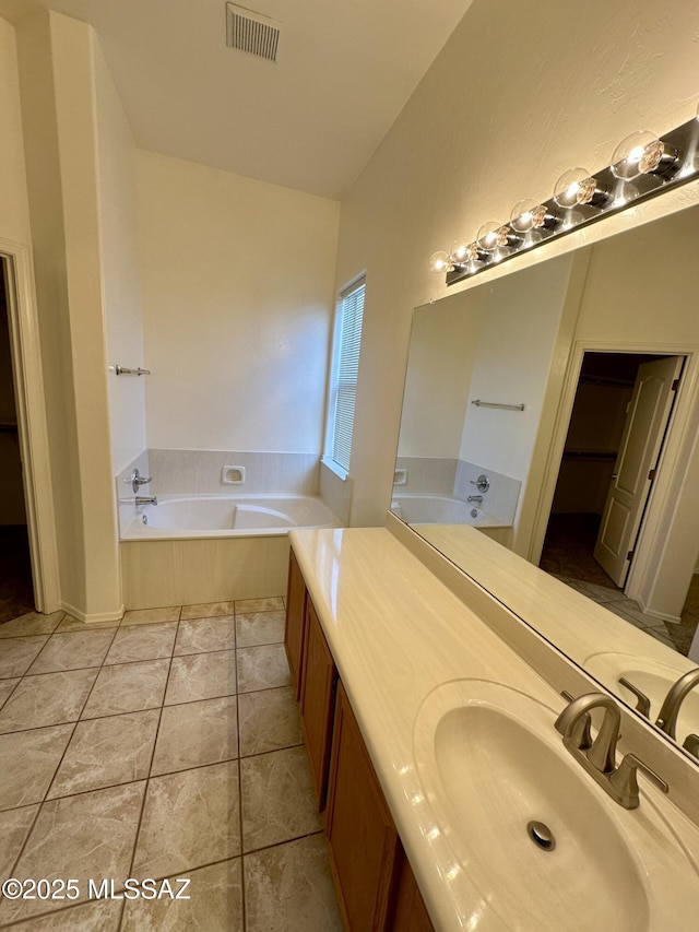 1989 N Camino Agrios, Tucson, AZ 85715 - bathroom featuring a bath, vanity, and tile patterned floors