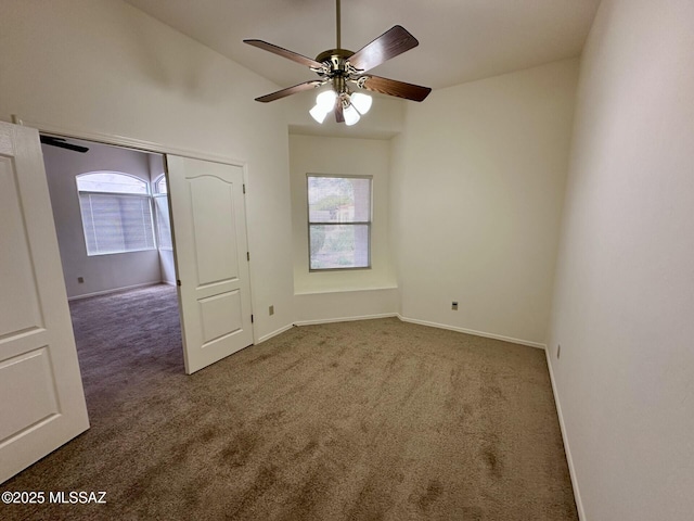 1989 N Camino Agrios, Tucson, AZ 85715 - carpeted empty room featuring healthy amount of natural light, ceiling fan, baseboards, and lofted ceiling