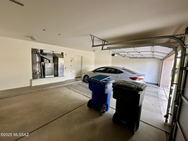 1989 N Camino Agrios, Tucson, AZ 85715 - garage featuring gas water heater, heating unit, and a garage door opener